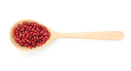 Peppercorns in wooden spoon isolated on white, top view