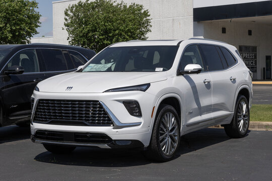 Buick Enclave Avenir SUV display at a dealership. Buick offers the Enclave with a 2.5L Turbo 4-Cylinder engine. MY:2025