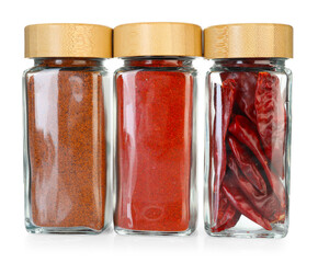 Many different aromatic spices in jars isolated on white