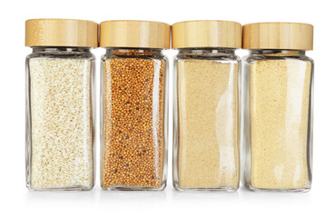 Many different aromatic spices in jars isolated on white
