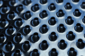 close - up of a metal grater textured background