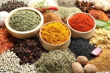 Many different spices on table, above view