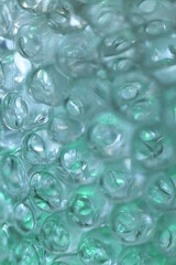 abstract green background of hydrogell balls, macro photo
