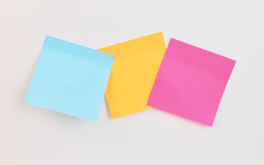 Colorful sticky notes arranged on a light background
