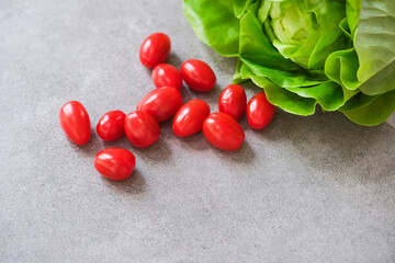 Lettuce, tomato, cucumber and salad on grey background. Fresh vegetables