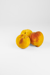 Peaches isolated in close-up with white background and copy space