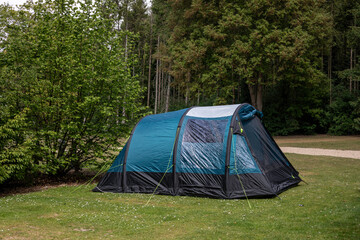 Camping in a forest campsite in an air tent