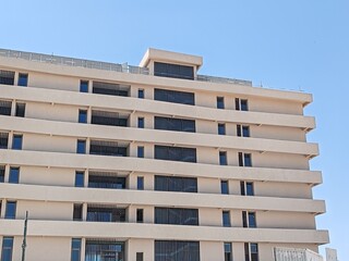 Residential Cream Color Multi Story building modern design Exterior View with Balcony black glass windows.
Aluminum Baffle Shape Cladding Balcony Facade Architecture Panel Decoration Horizontal Tower.