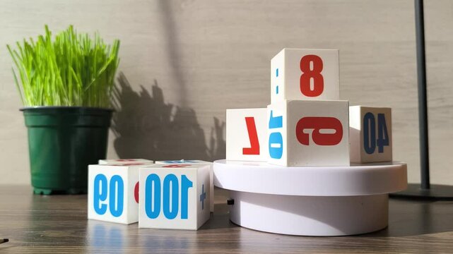 White plastic cubes with colorful letters and numbers