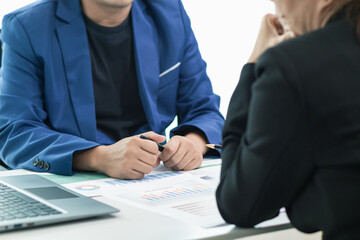 business consultant is advising an Asian businesswoman on her business investment after reviewing...