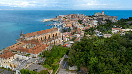Obraz premium Skyline of the historic center of the town of Gaeta, overlooking the Mediterranean Sea. It's a tourist destination in province of Latina, Lazio, Italy. In foreground there is the temple of St. Francis