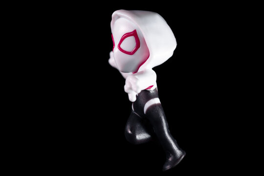 Spider-Woman in a white hood and red glasses