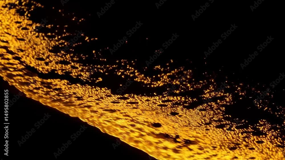 Aufkleber abstract close-up of textured gold surface with dark shadowy patches creating a contrast on a black 
