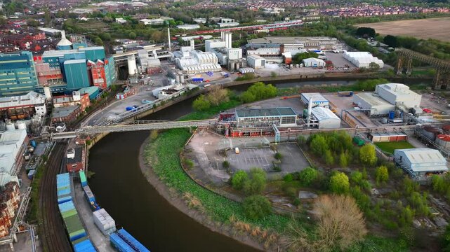 Aerial video of Warrington's old factory and river Mersey 