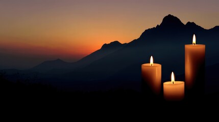 Serene Sunset: Three Candles Silhouette Against Majestic Mountains