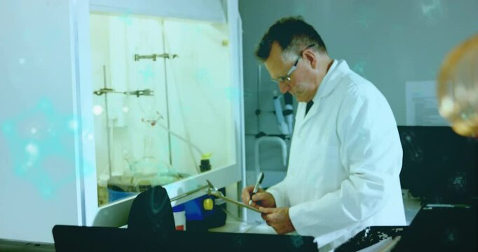 Coil focus shifting to scientist monitoring reaction in chemistry lab fume hood logging data