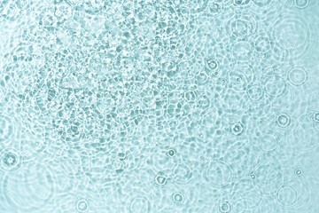 Clear water surface with soft ripples and mesmerizing light reflections. High-resolution photo.