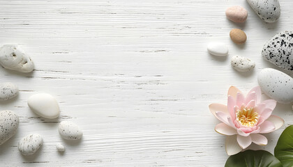Stones with lotus flower and space for text on white wooden background, flat lay. Zen lifestyle