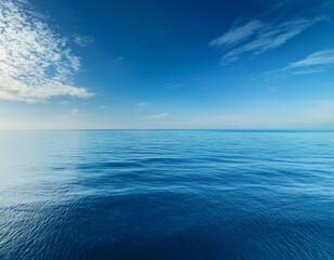 Obraz premium calm ocean waters under a clear sky reflecting serene tranquility
