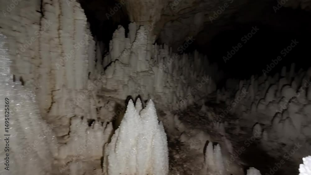 Poster spectacular view of unique white formations hanging from the ceiling inside a cavern with walls and 