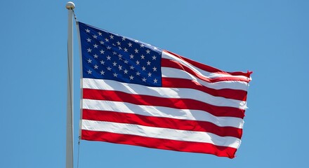 Obraz premium American flag waving proudly in the wind on Independence Day