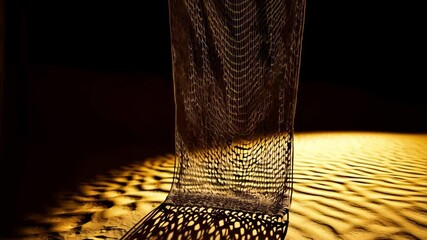 Abstract composition of draped net creating strong shadows on textured golden surface near weathered pole in dim light environment
