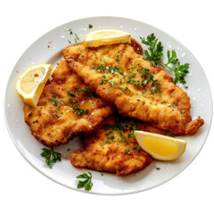Crispy fried fish fillets garnished with lemon and parsley on a white plate