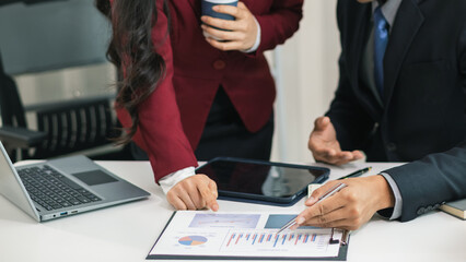 Businesswoman talking to business consultant to make decision on new business investment to make...