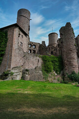 The Majestic and Enigmatic Ruins of an Ancient Castle are Beautifully Surrounded by Lush Greenery