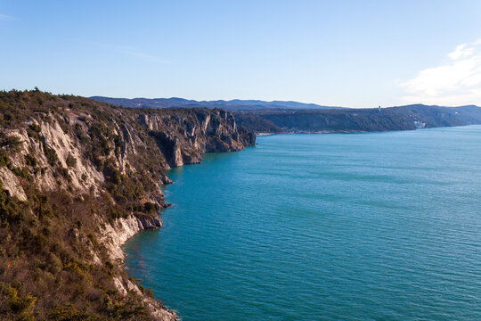 Duino, Italy - January 11, 2025: The coastline profile seen from the castle.