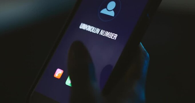 Hands, person or answer incoming call on phone screen with unknown number, stranger or anonymous caller. Night, smartphone connection and contact with private id for phishing scam, networking or spam
