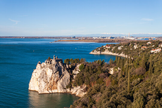 Duino, Italy - January 11, 2025: The old castle of Duino, now in ruins, overlooks the sea.

