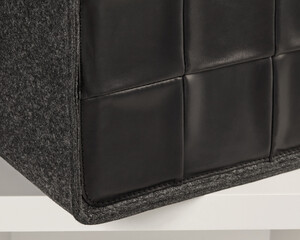 Modern black leather and felt storage box sitting on white shelf