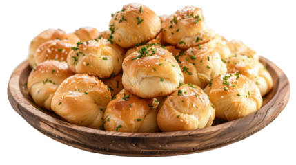 Freshly baked garlic knots served in a rustic wooden bowl, garnished with herbs