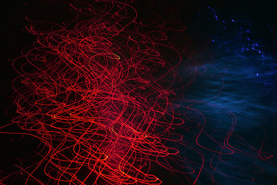Abstract long exposure photography of red and blue light trails