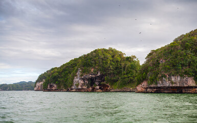 Samana, Dominican Republic. Lush green hills and rocky cliffs
