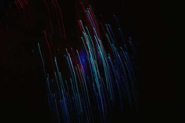 Abstract long exposure photography of red and blue light trails