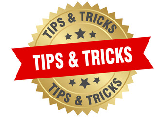 tips & tricks. tips & tricks round red and gold label isolated on transparent background