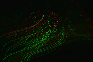 Abstract long exposure photography of red and green light trails