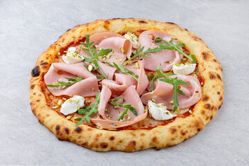 Overhead View of Neapolitan Pizza with Mortadella, Ricotta, Arugula and Pistachios