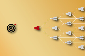 Leadership concept. Red paper plane origami leading among small yellow planes on blue background....