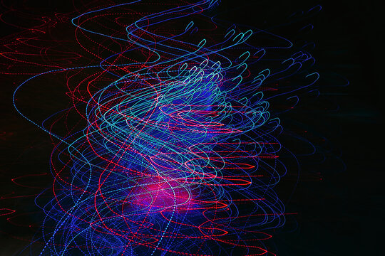 Abstract long exposure photography of red and blue light trails