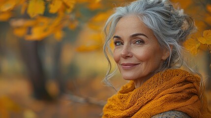 Elegant woman in autumnal scarf standing amidst vibrant fall foliage