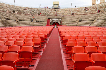 Red seats in the historic amphitheater arena.