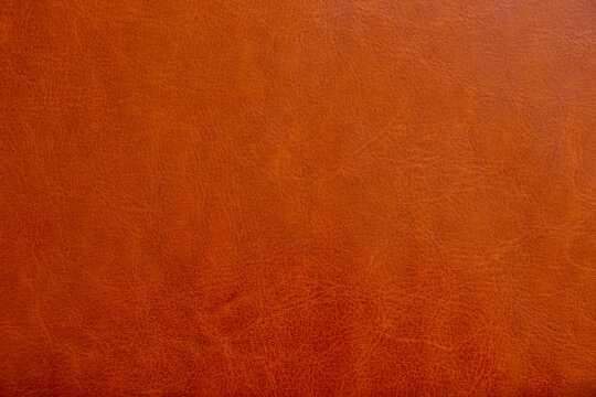 Red leather smooth old as background, leather texture