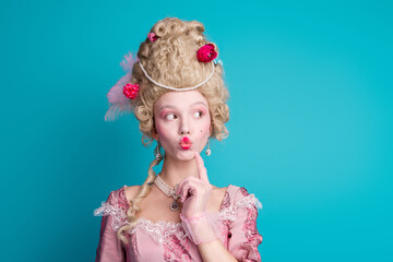 Photo of thoughtful duchess medieval lady hand touch face theater performance isolated on blue...