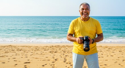 Joyful man with camera enjoying a sunny day at the beach