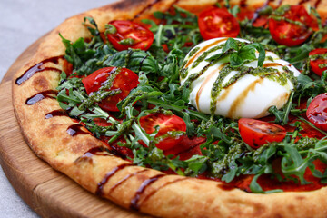 Burrata Arugula Pizza with Cherry Tomatoes Pesto and Balsamic Drizzle