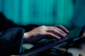 A hacker actively attempts to breach systems and steal sensitive data, representing cybercrime and...