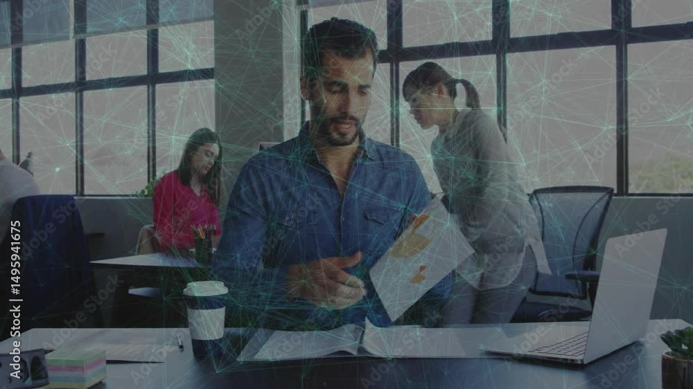 Poster man picking up top sheet and highlighting chart data for business report analysis in office